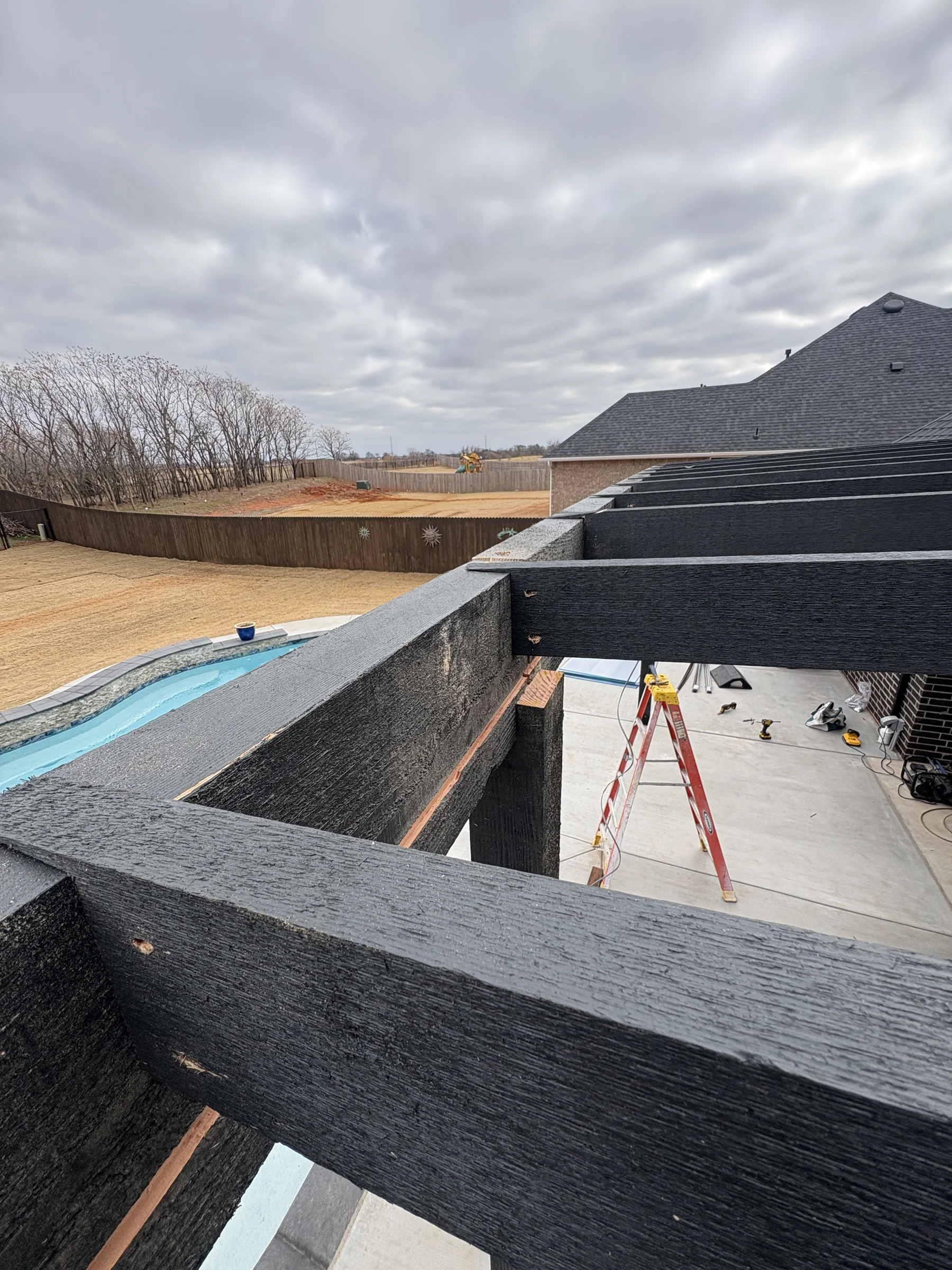 Mid-assembly view of pergola joist layout — Northcutt build by Pergola Jack