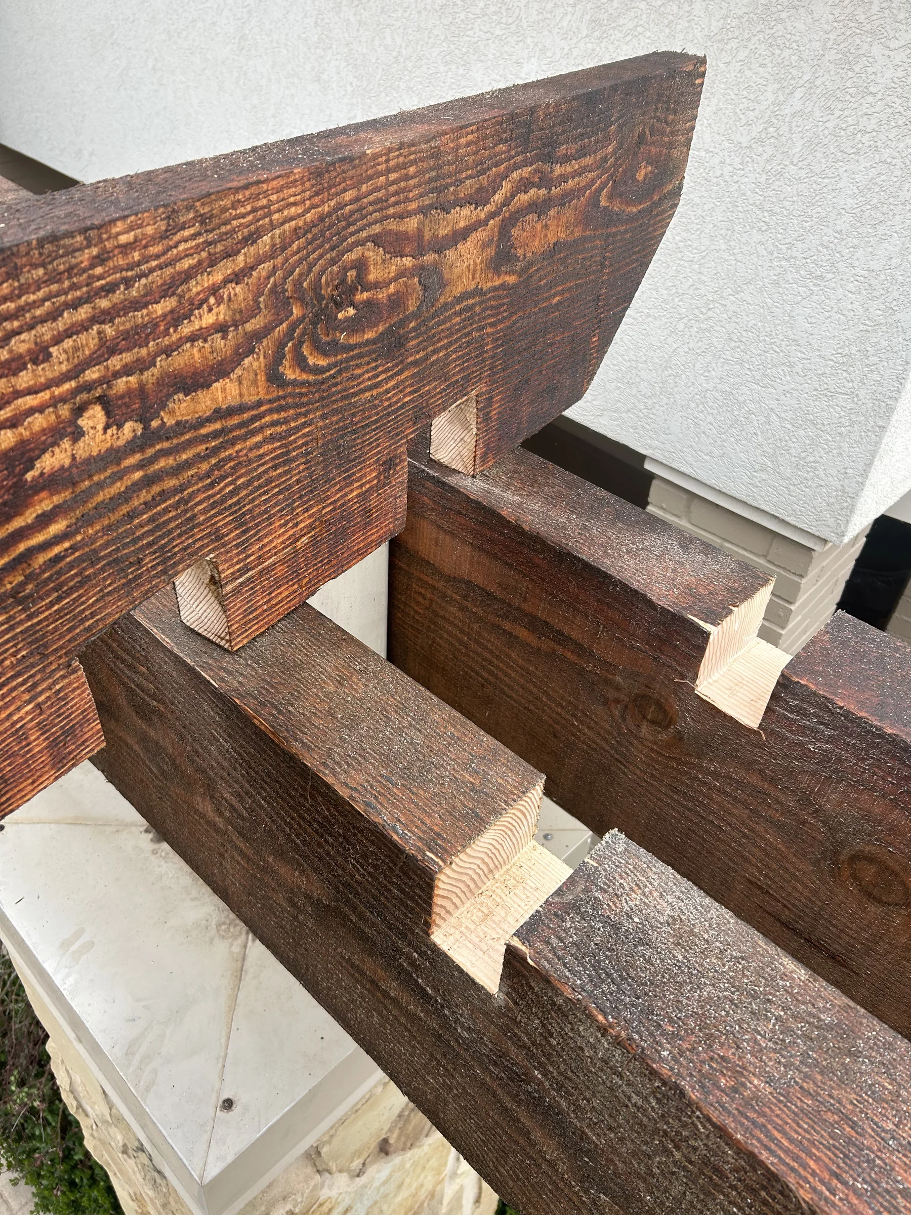 Pergola beam assembly showing handcrafted precision joinery